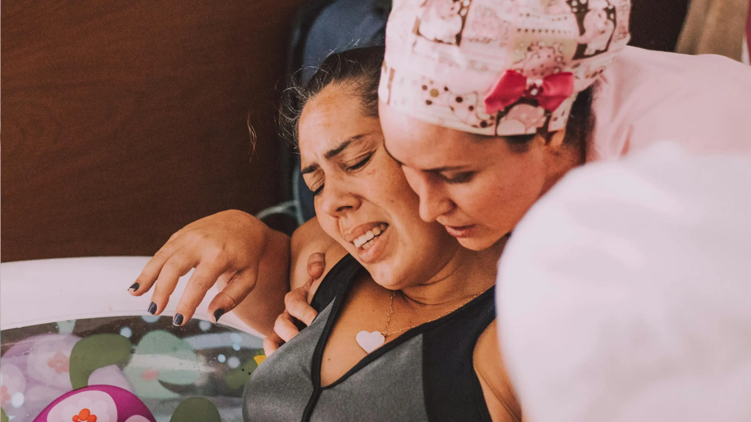 midwife assisting in a water birth